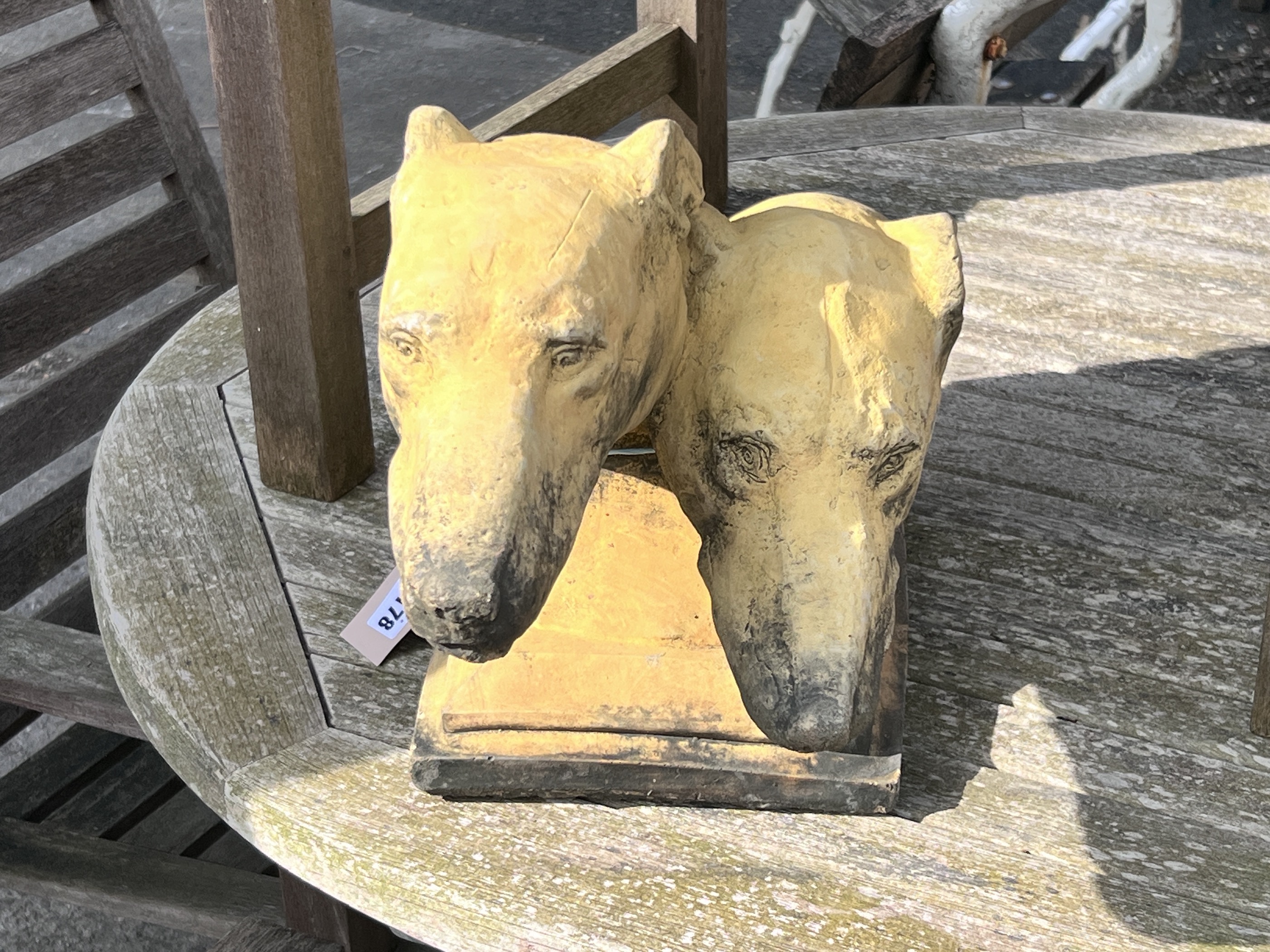 An Art Deco terracotta double Borzoi head finial, length 48cm